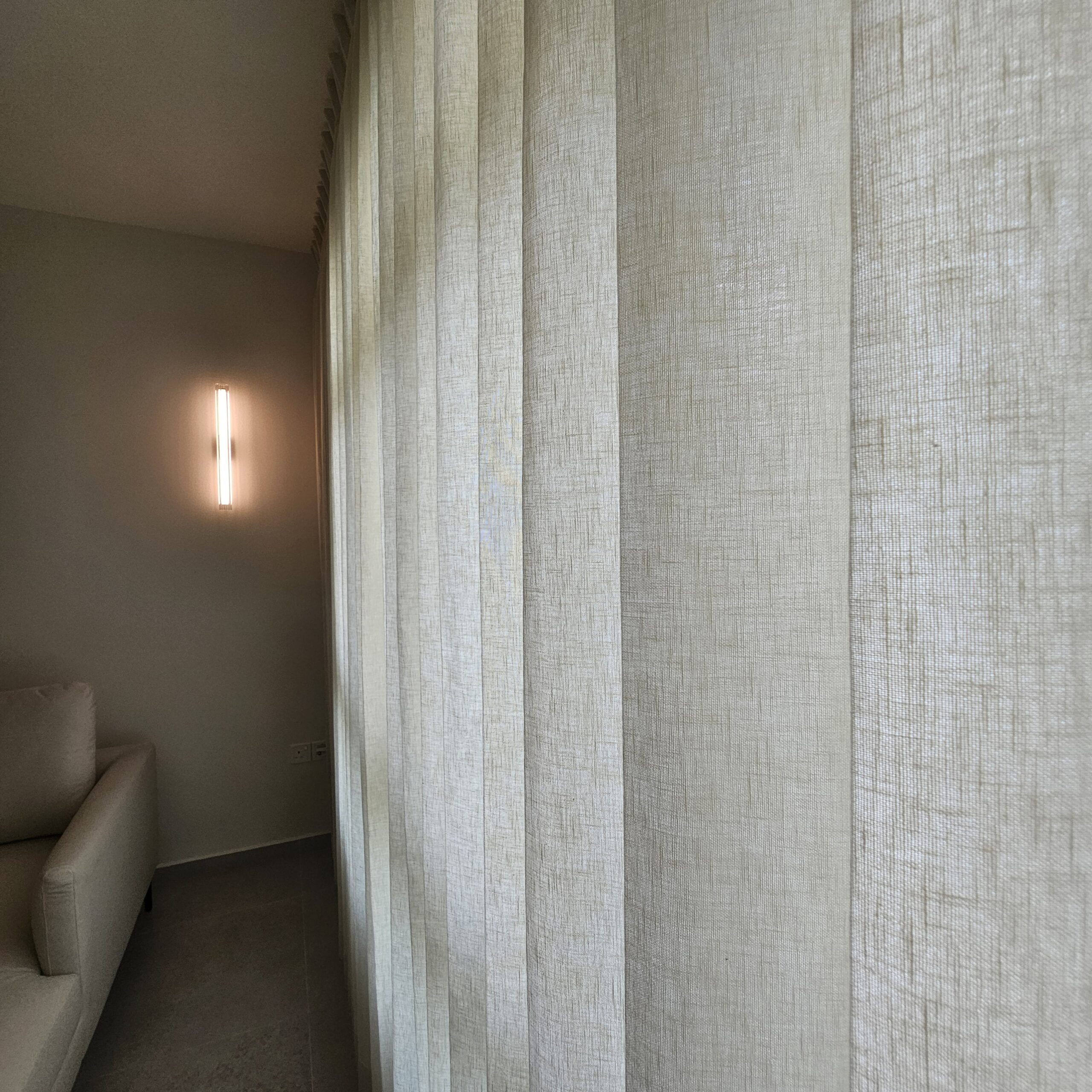 Close-up of linen textured Night curtain fabric showing its woven finish
