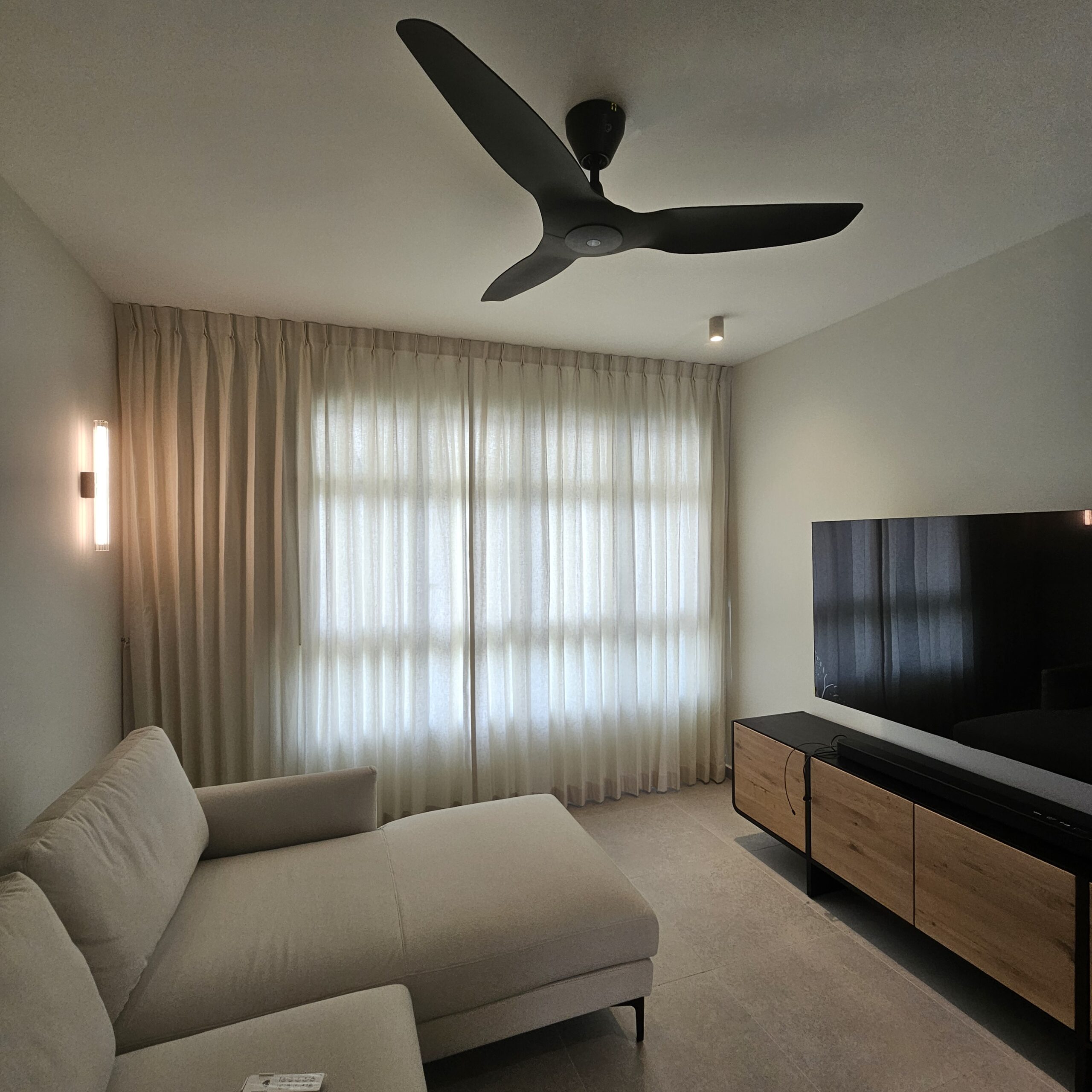 Shaped Linen Night curtains softly filtering natural light in a contemporary living room