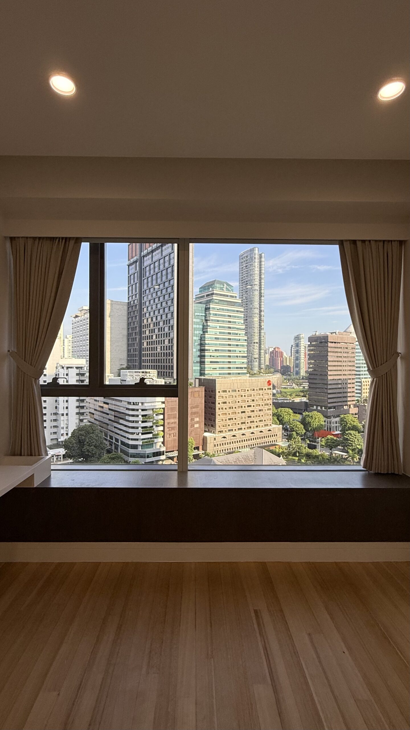 Shaped Dim-Out night curtains framing a large window with an open view