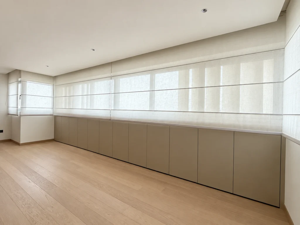 Angled view of closed sheer Roman blinds with equal fold construction in a Singapore home